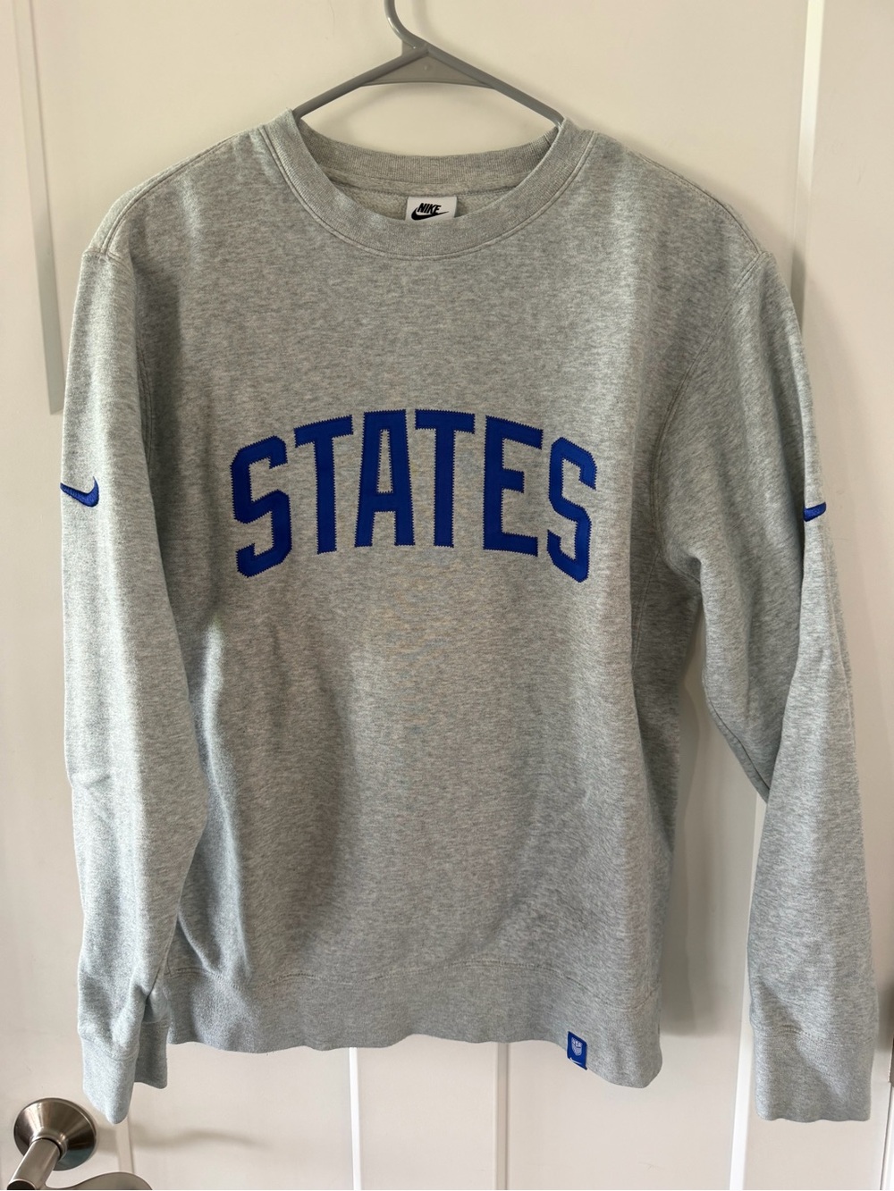Nike Gray Crewneck Sweatshirt with Royal Blue 'STATES' Text